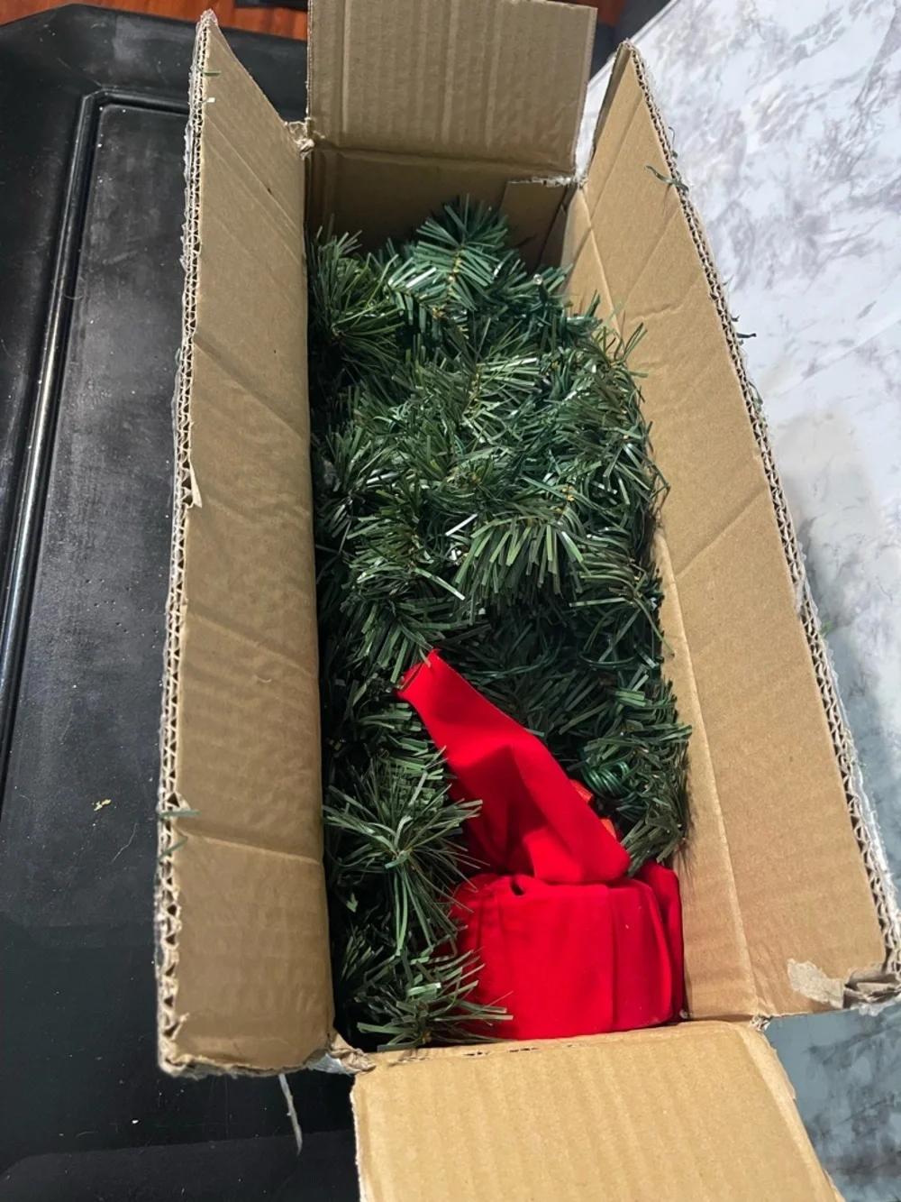 Green Mini Holiday Tree with Multicolor Lights and Red Fabric Base